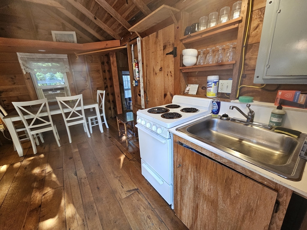 1937 State Hwy Route, Unit 8 Wellfleet, MA 02667 - Photo 5 of 17 a utility room with lots of appliances and cabinets