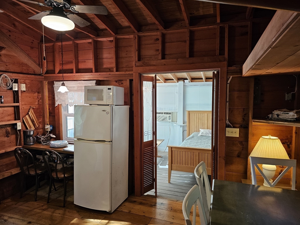 1937 State Hwy Route, Unit 8 Wellfleet, MA 02667 - Photo 6 of 17 a view of kitchen with furniture and a refrigerator