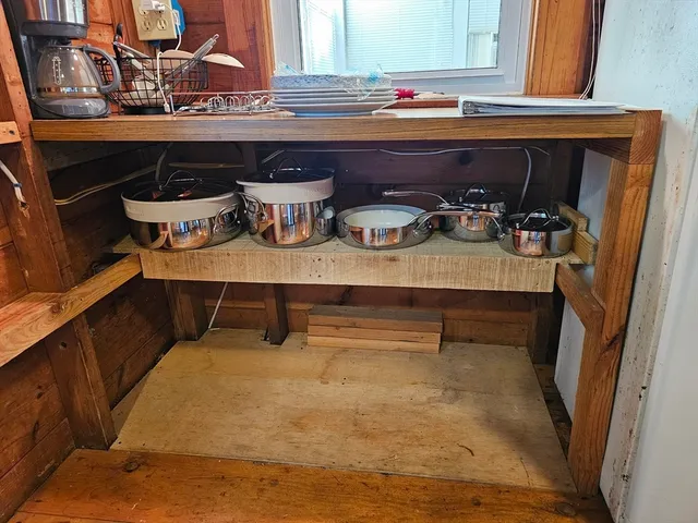 a room with lots of wooden cabinets