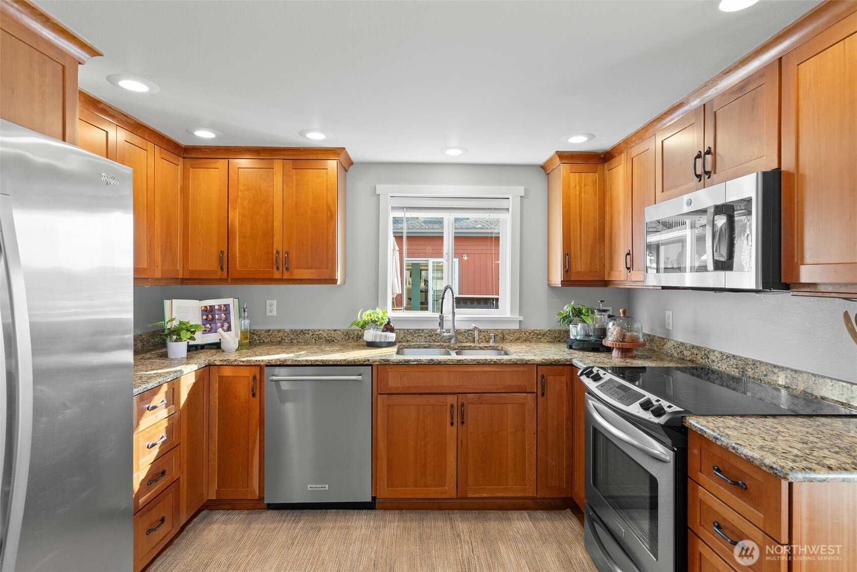 1542-1538 South Wilton Road Tacoma, WA 98466 - Photo 29 of 40 a kitchen with stainless steel appliances granite countertop a sink stove and refrigerator