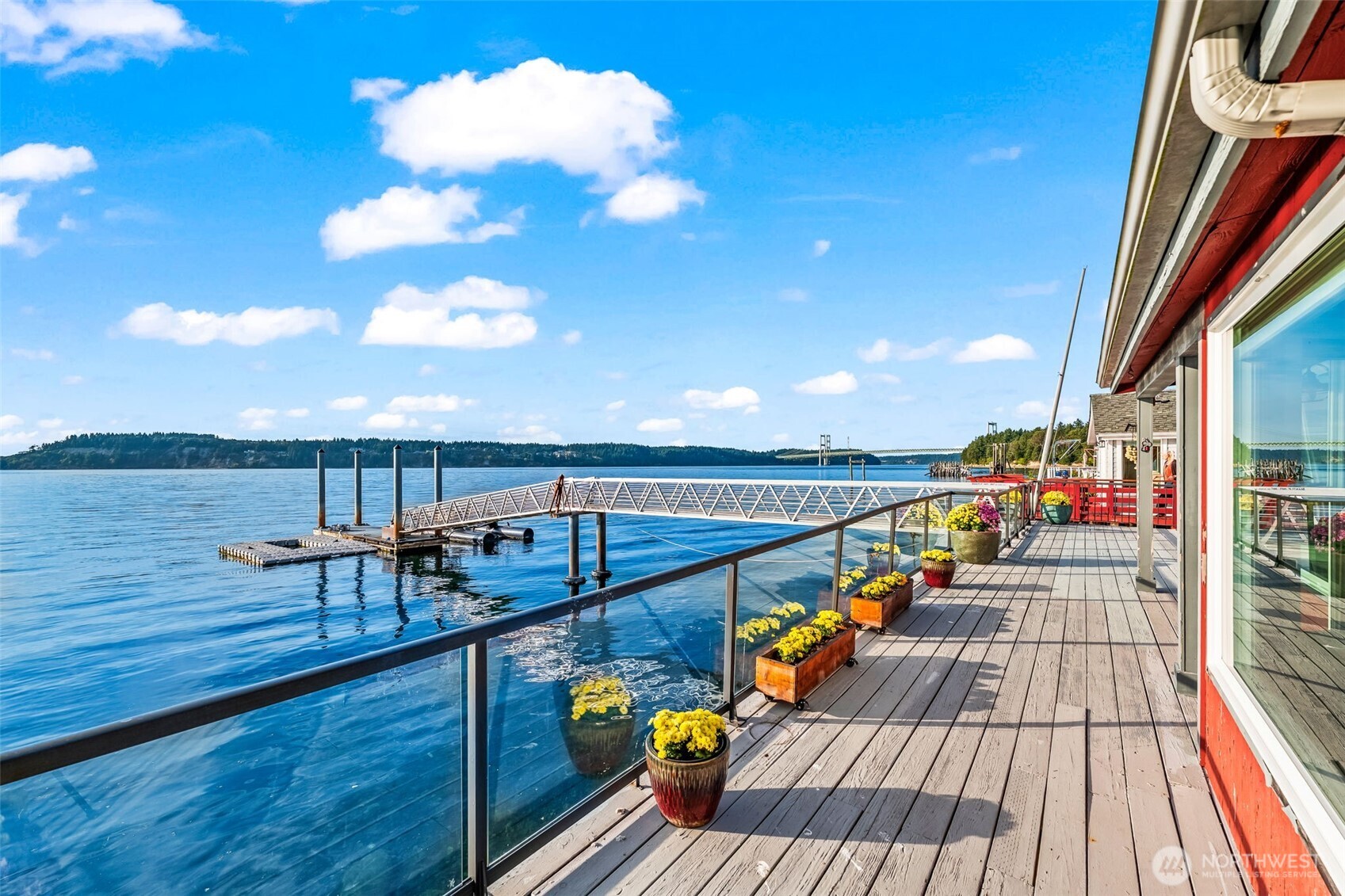 1542-1538 South Wilton Road Tacoma, WA 98466 - Photo 3 of 40 a view of chairs on the deck with wooden floor