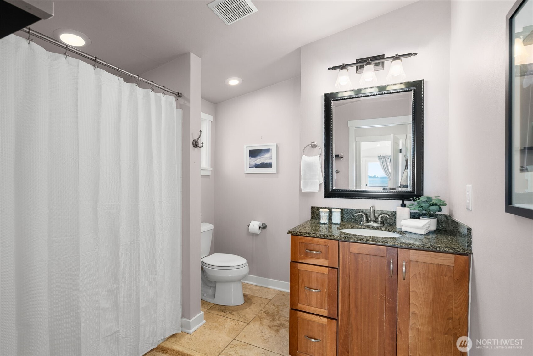 1542-1538 South Wilton Road Tacoma, WA 98466 - Photo 32 of 40 a bathroom with a toilet a sink and a mirror