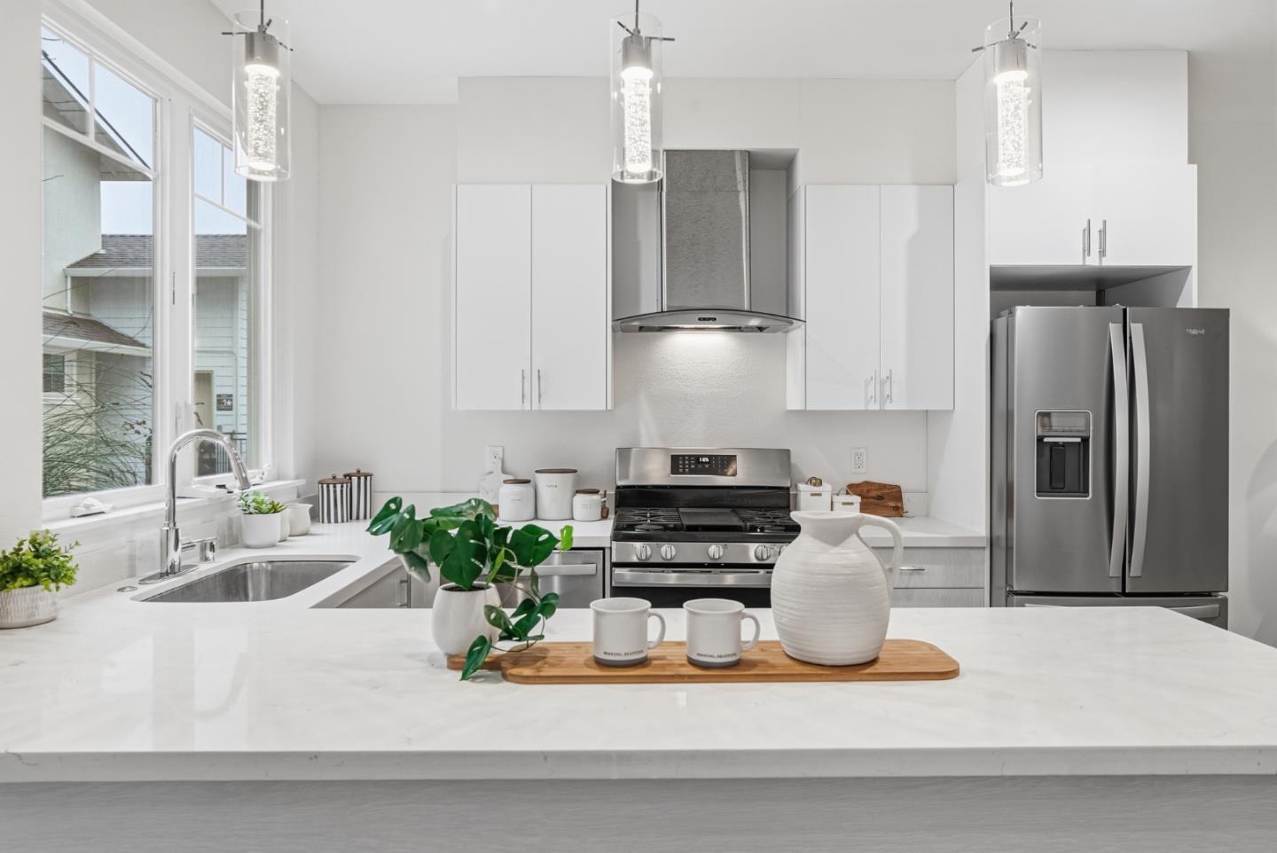 139 Flynn Avenue Mountain View, CA 94043 - Photo 14 of 34 a kitchen with stainless steel appliances granite countertop a refrigerator and a sink