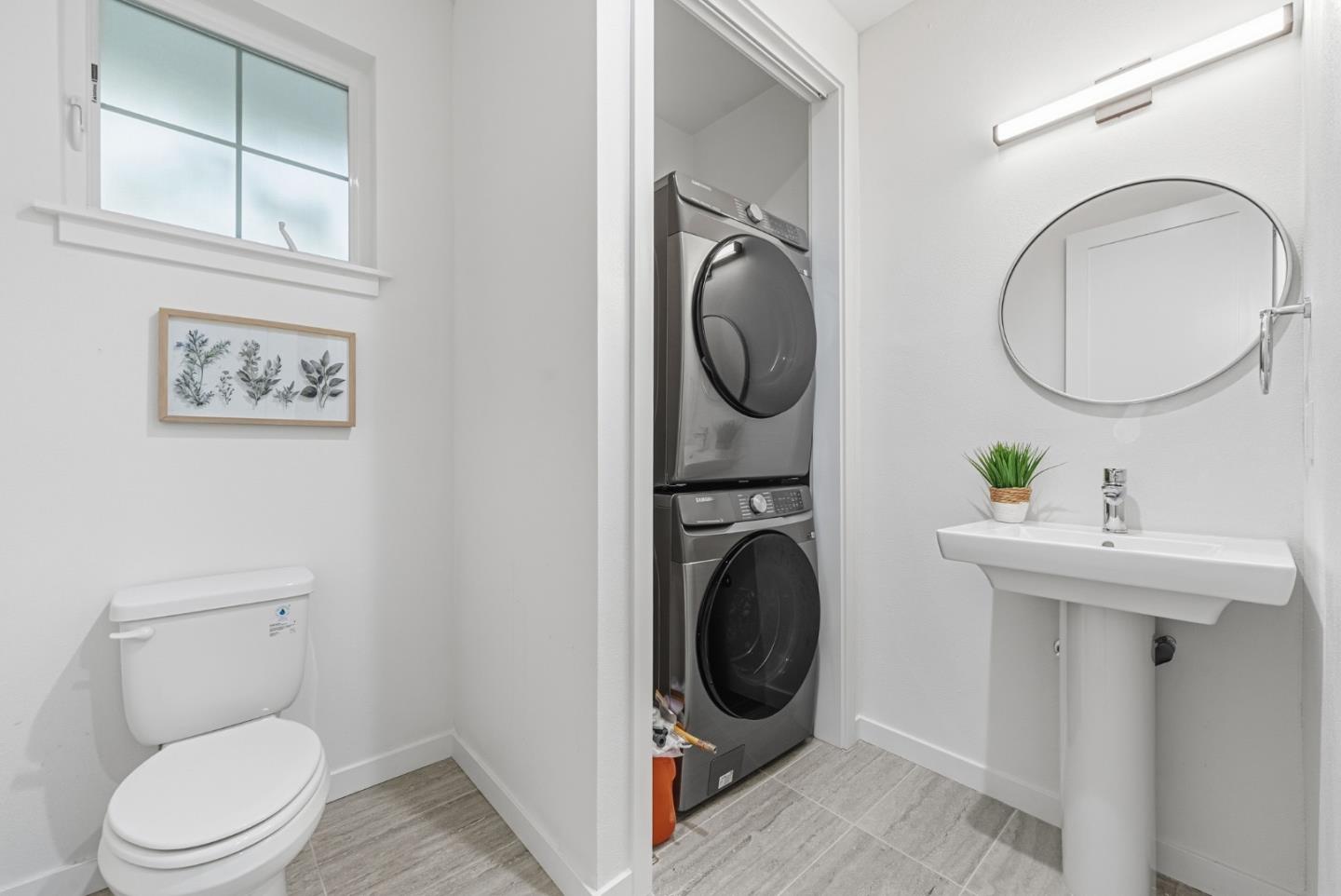 139 Flynn Avenue Mountain View, CA 94043 - Photo 15 of 34 a bathroom with a toilet a sink and a mirror