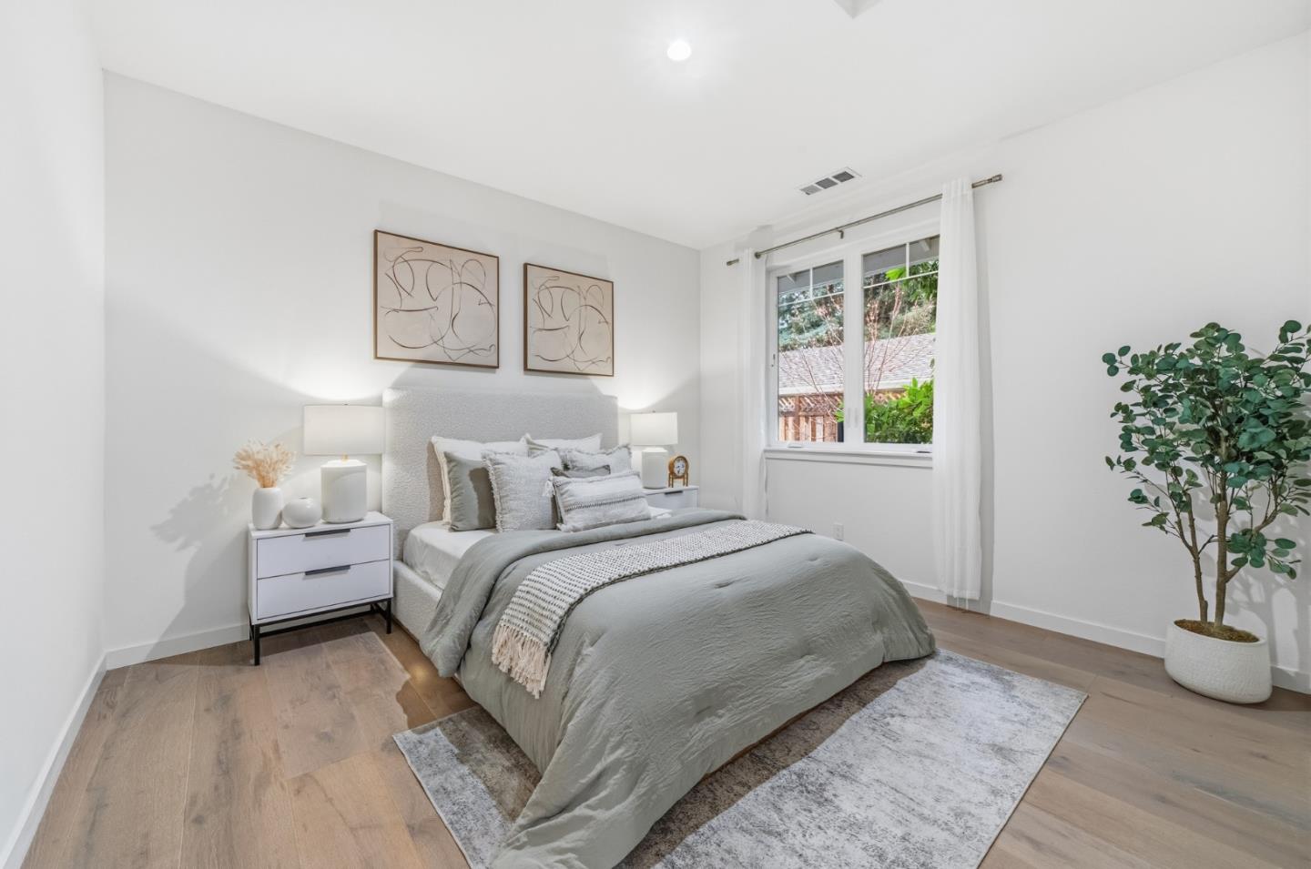 139 Flynn Avenue Mountain View, CA 94043 - Photo 16 of 34 a bedroom with a bed and a potted plant