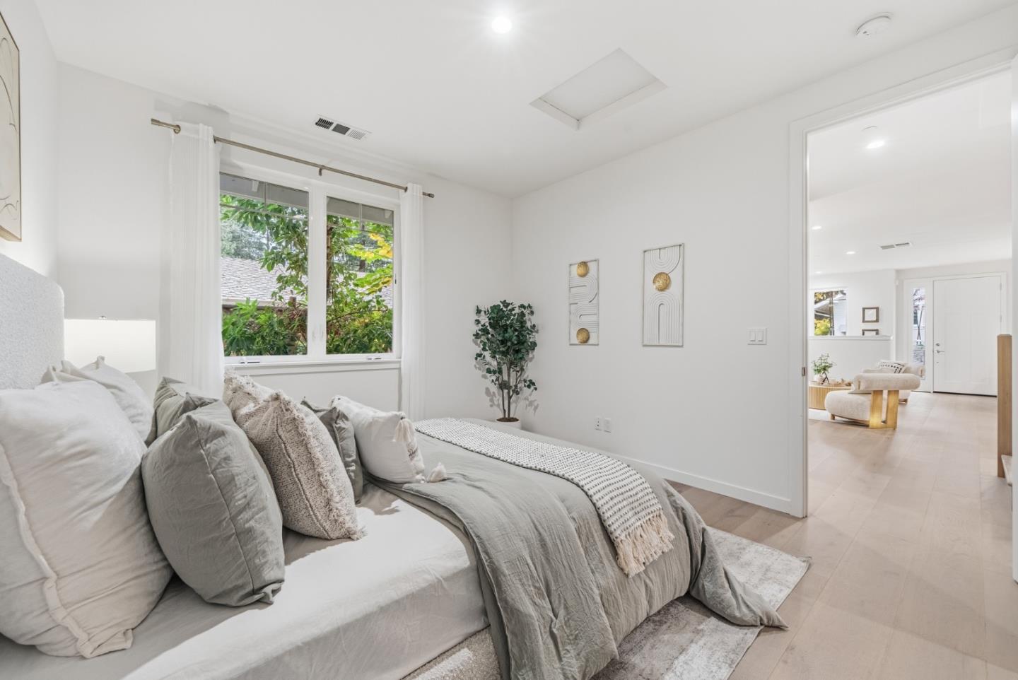 139 Flynn Avenue Mountain View, CA 94043 - Photo 20 of 34 a bed sitting in a bedroom next to a window