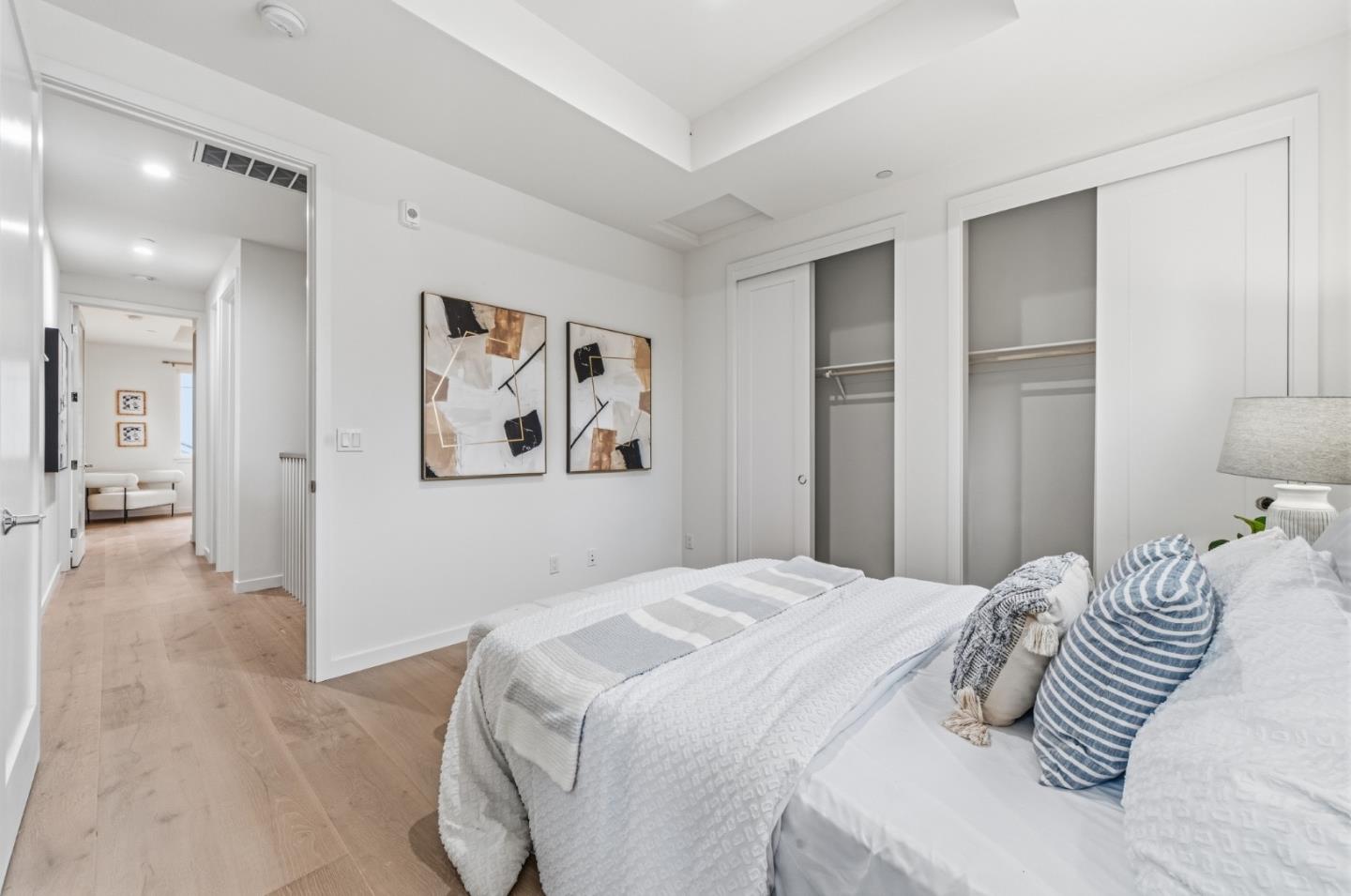 139 Flynn Avenue Mountain View, CA 94043 - Photo 24 of 34 a bedroom with a large bed and a chandelier