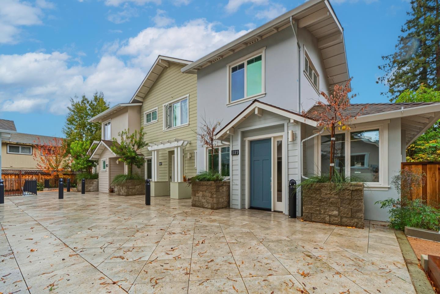 139 Flynn Avenue Mountain View, CA 94043 - Photo 31 of 34 a view of a white house with large windows next to a road