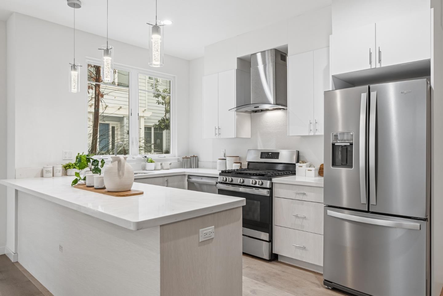 139 Flynn Avenue Mountain View, CA 94043 - Photo 10 of 34 a kitchen with stainless steel appliances a sink a stove a refrigerator and cabinets