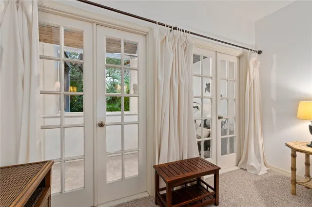 a bathroom with a granite countertop toilet sink and mirror