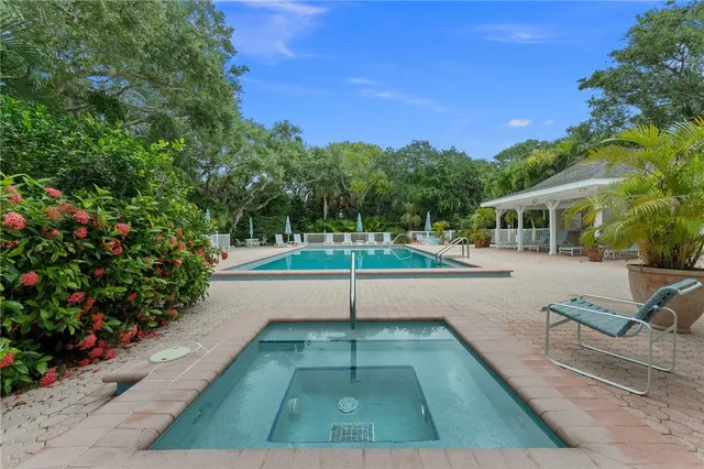 a view of a white house with a yard