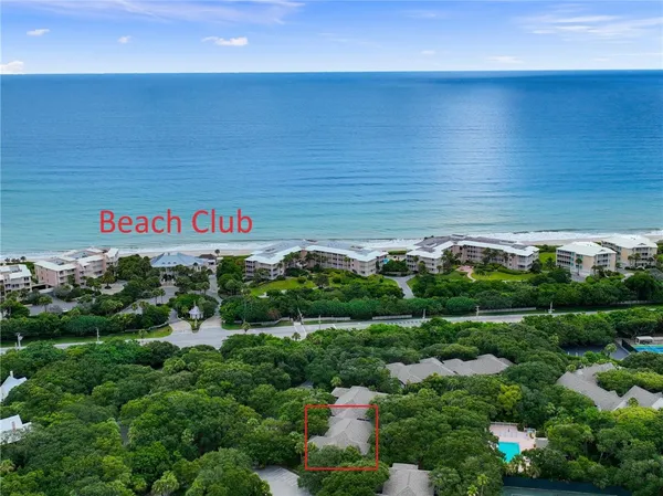 a dining room with furniture garden view and a potted plant
