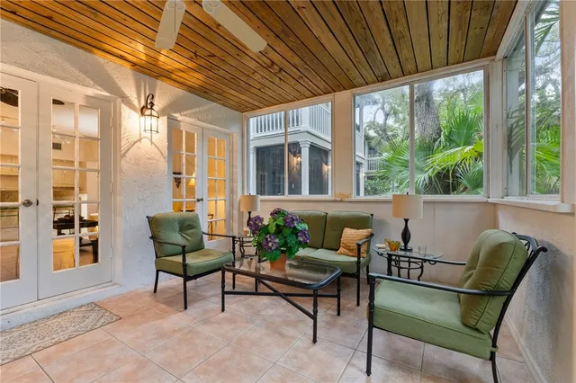 a view of a patio with a dining table and chairs