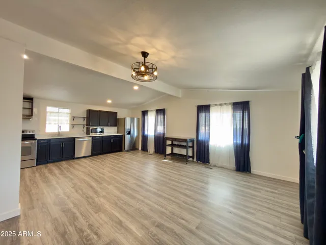 a view of a hall with kitchen and sink