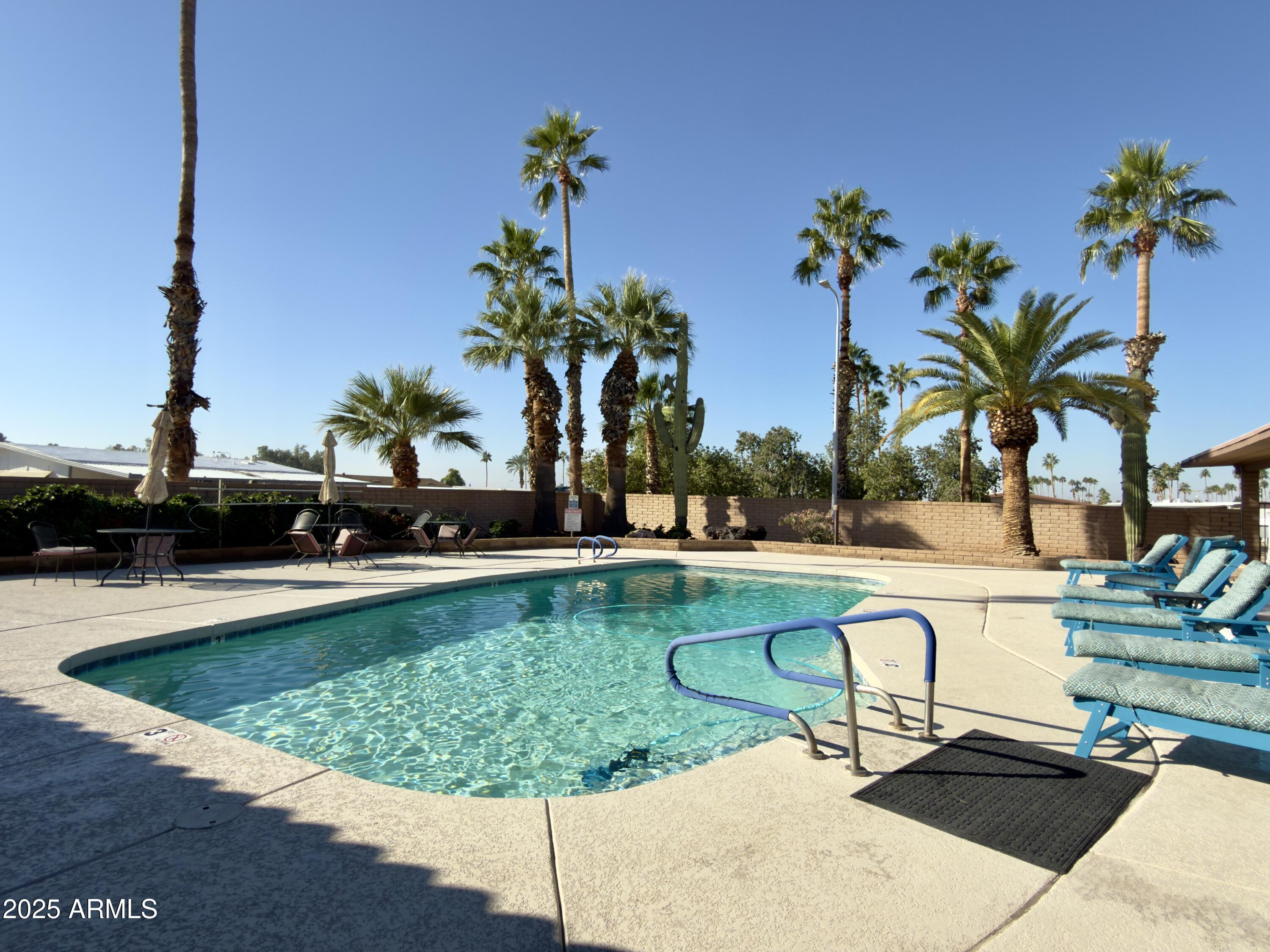 1855 West Southern Avenue, Unit 331 Apache Junction, AZ 85120 - Photo 9 of 13 a view of swimming pool with seating space