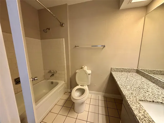 a bathroom with a sink and a shower