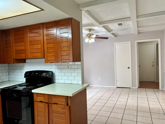 a kitchen with a cabinets and window