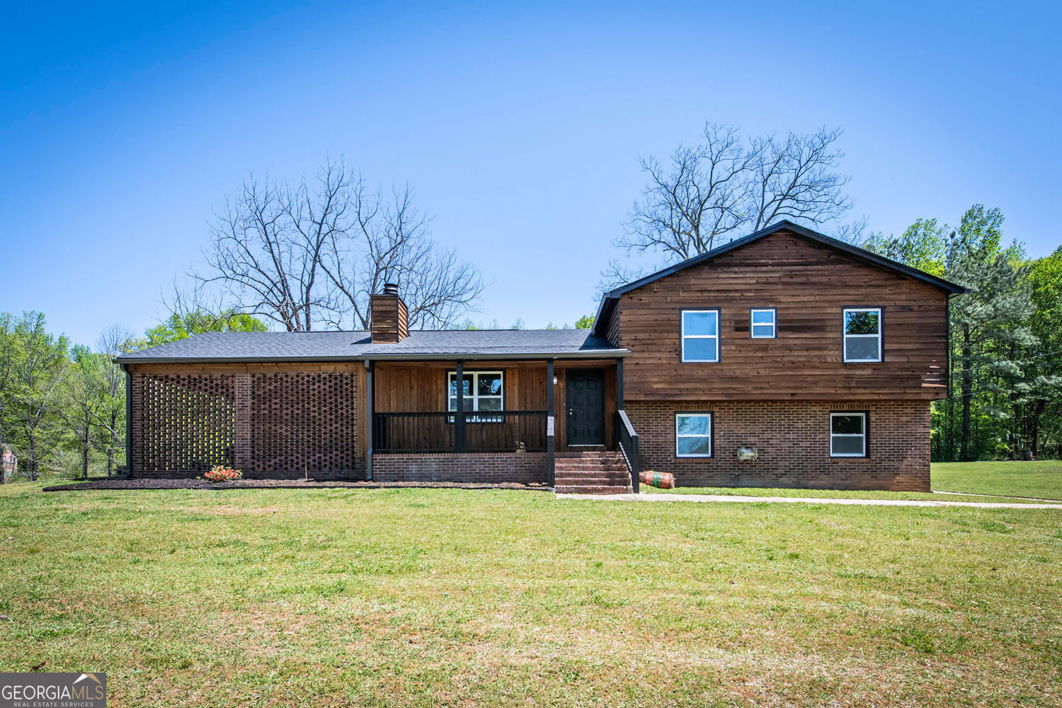 a front view of a house with a yard
