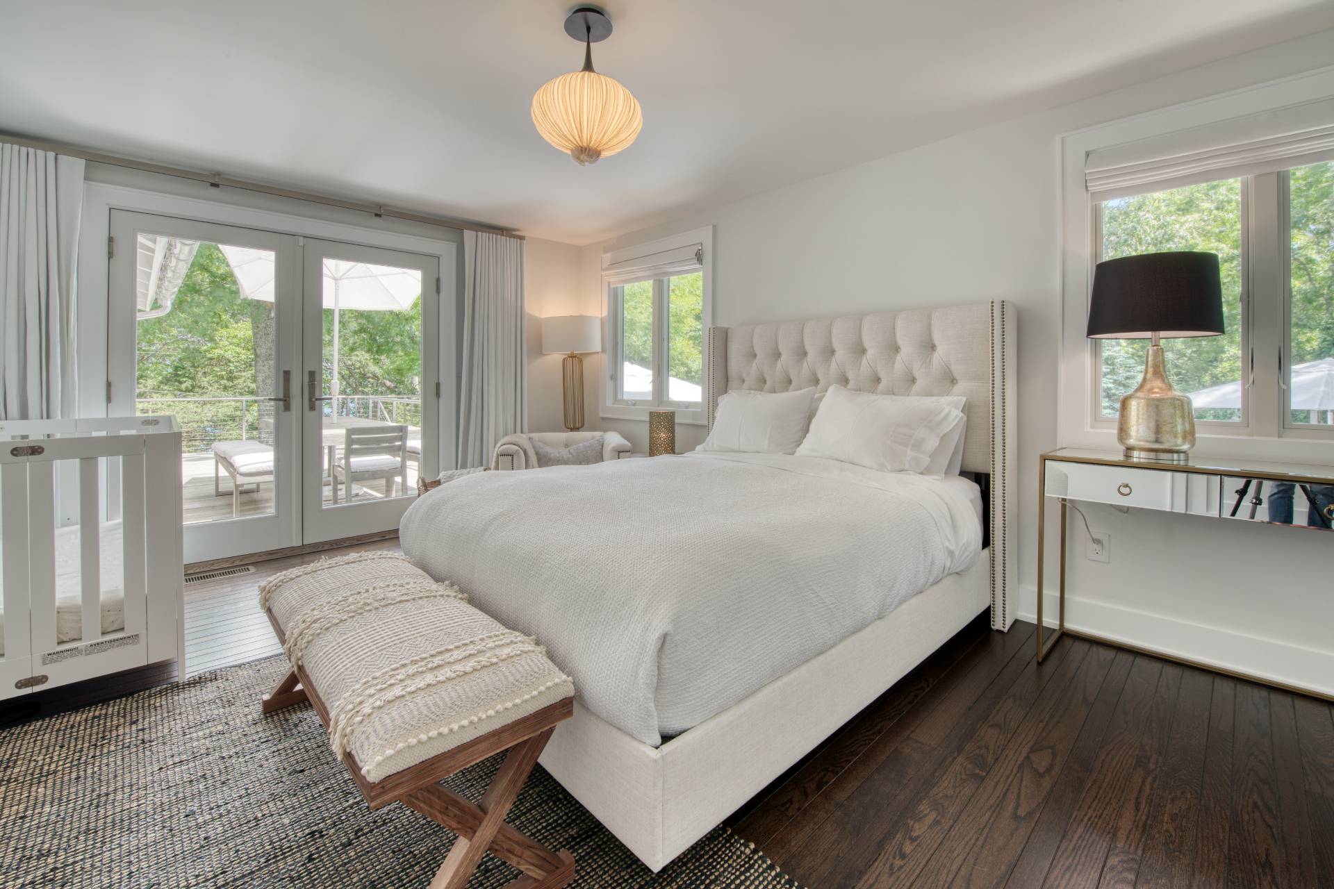 30 Springwood Way East Hampton, NY 11937 - Photo 12 of 32 a bedroom with a large bed and a window