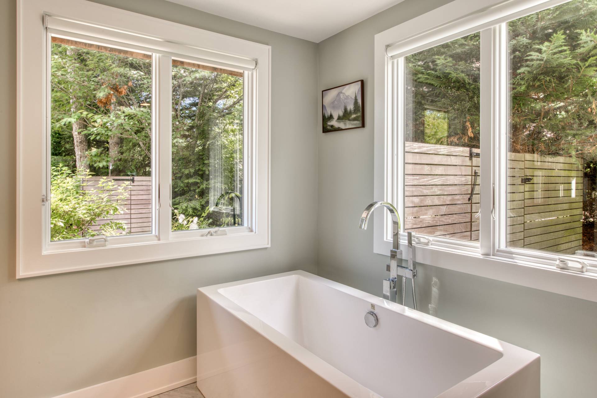 30 Springwood Way East Hampton, NY 11937 - Photo 14 of 32 a white bath tub sitting in a bathroom next to a window