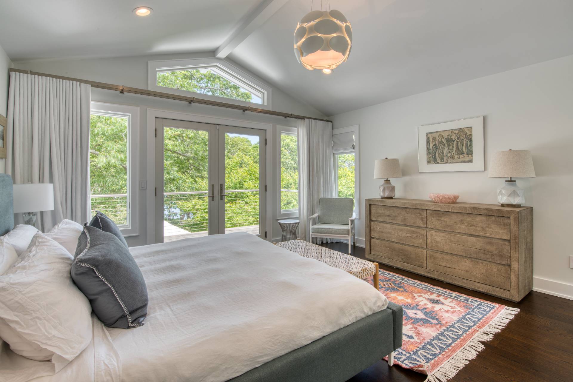 30 Springwood Way East Hampton, NY 11937 - Photo 15 of 32 a bedroom with a bed and a large window
