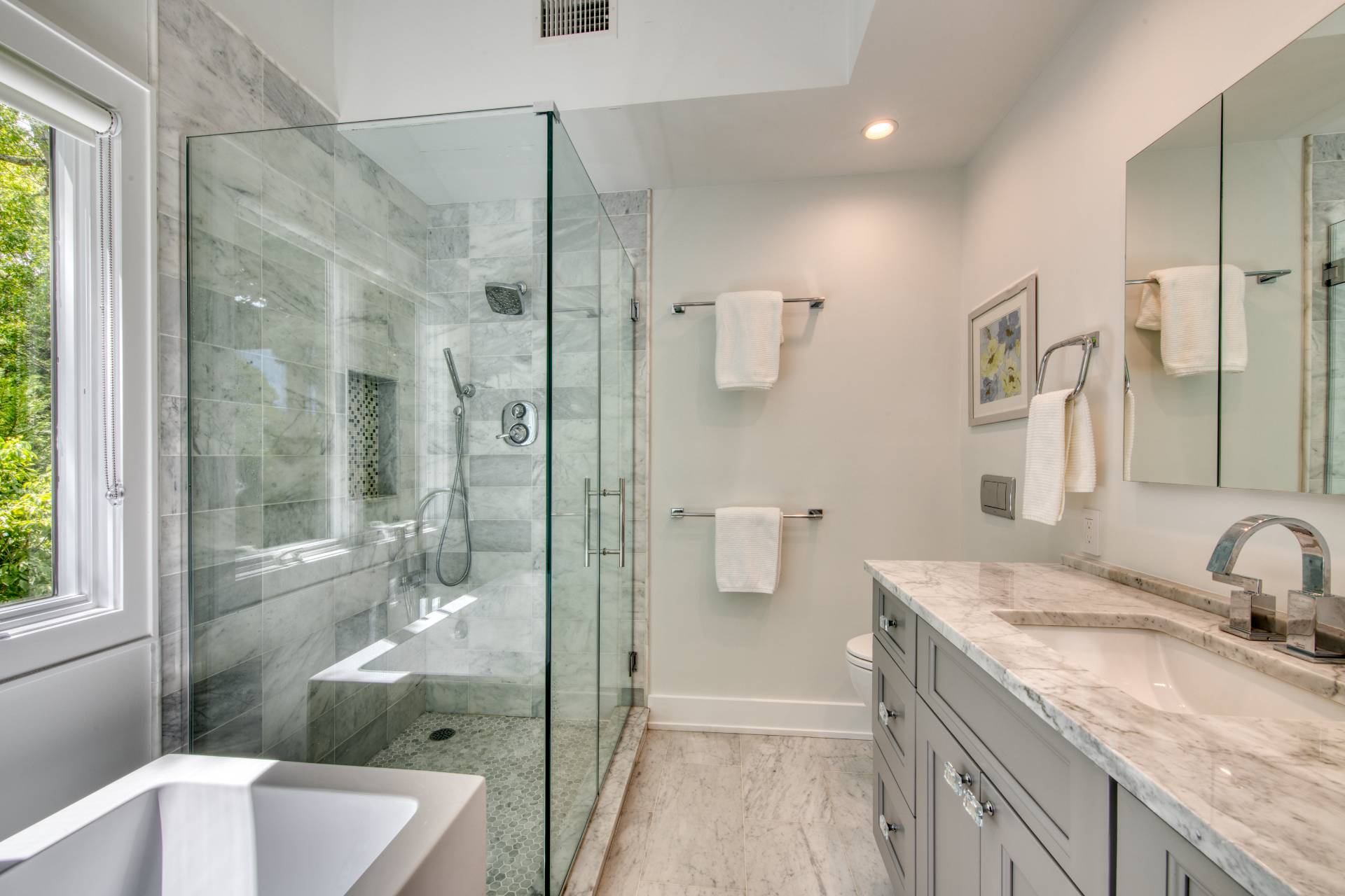 30 Springwood Way East Hampton, NY 11937 - Photo 17 of 32 a bathroom with a granite countertop sink a toilet and shower