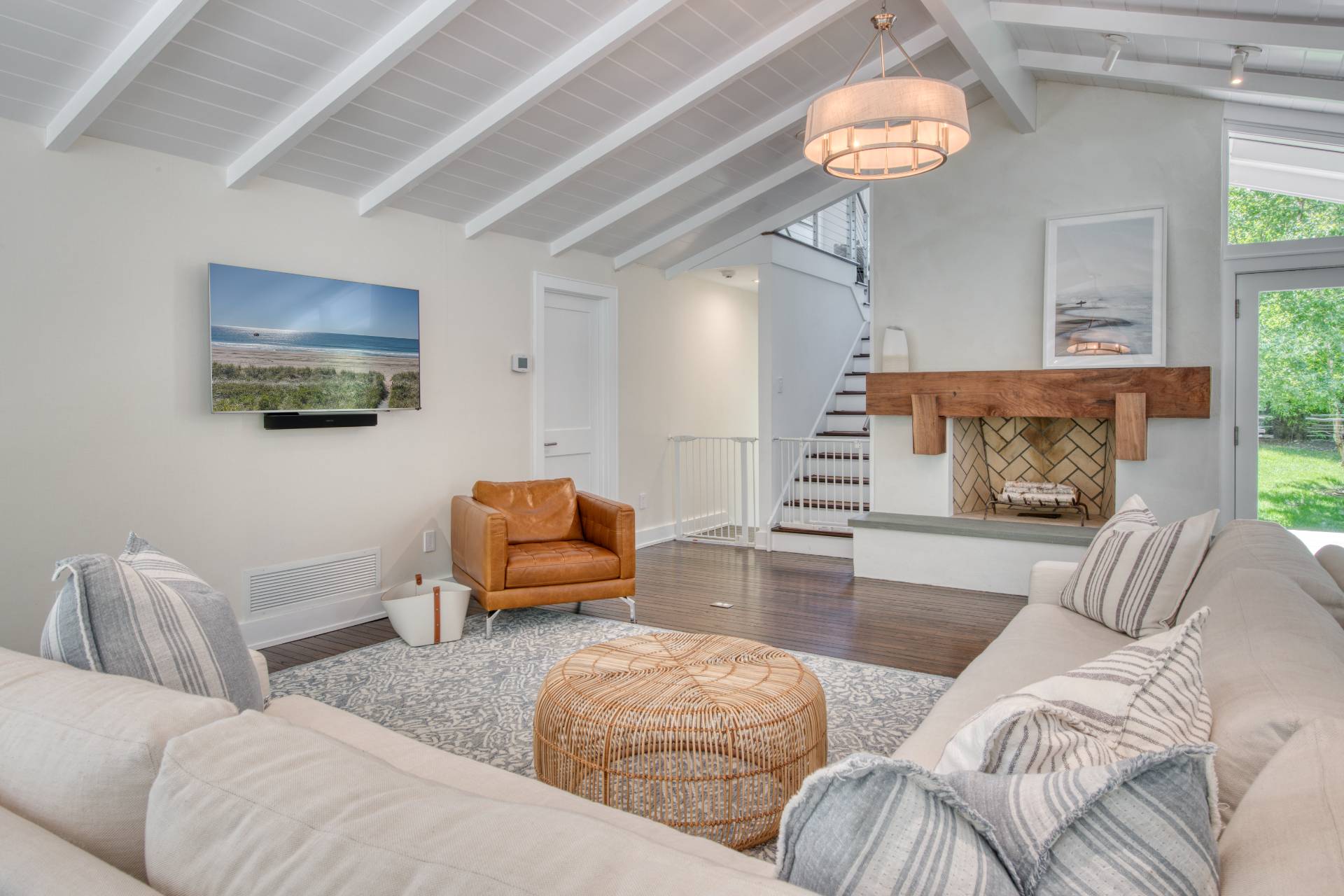 30 Springwood Way East Hampton, NY 11937 - Photo 8 of 32 a living room with furniture and a chandelier