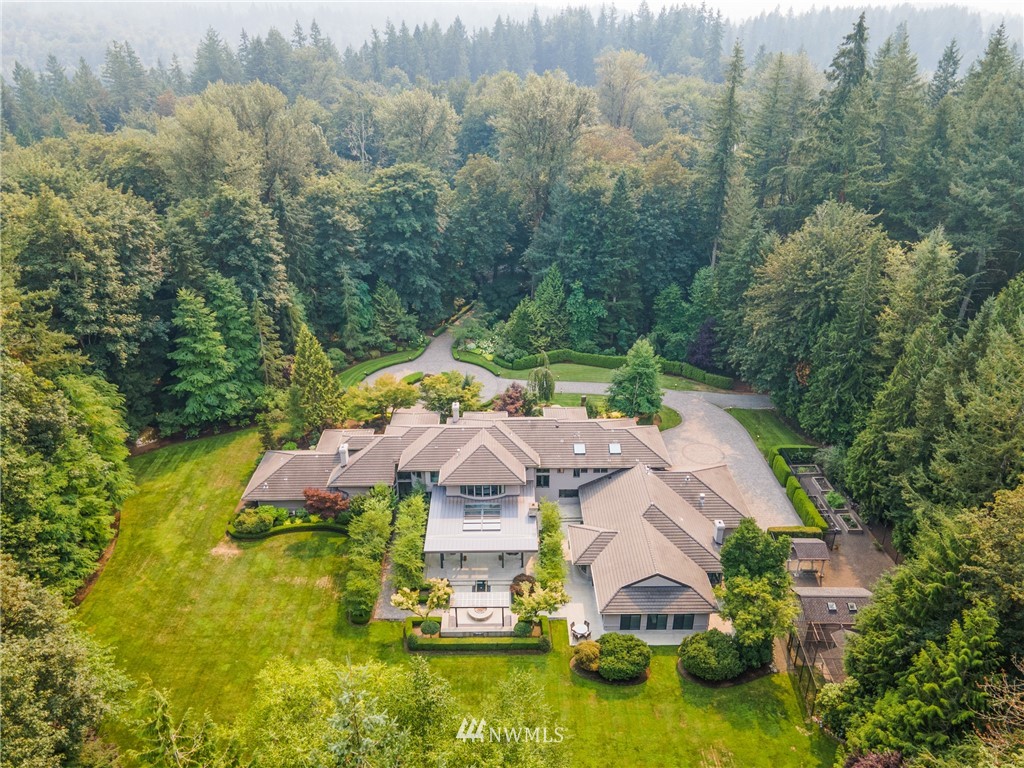 26630 Southeast Issaquah-Fall City Road Issaquah, WA 98029 - Photo 2 of 40 an aerial view of a house with swimming pool and garden