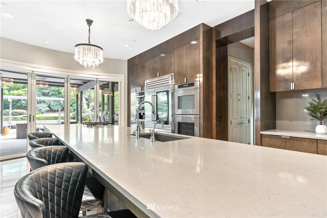 26630 Southeast Issaquah-Fall City Road Issaquah, WA 98029 - Photo 16 of 40 a view of a dining room with furniture wooden floor and a chandelier