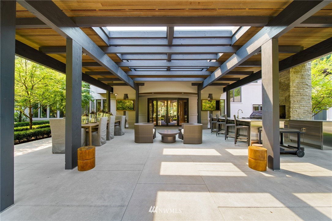 26630 Southeast Issaquah-Fall City Road Issaquah, WA 98029 - Photo 19 of 40 a living room with patio furniture and a wooden floor