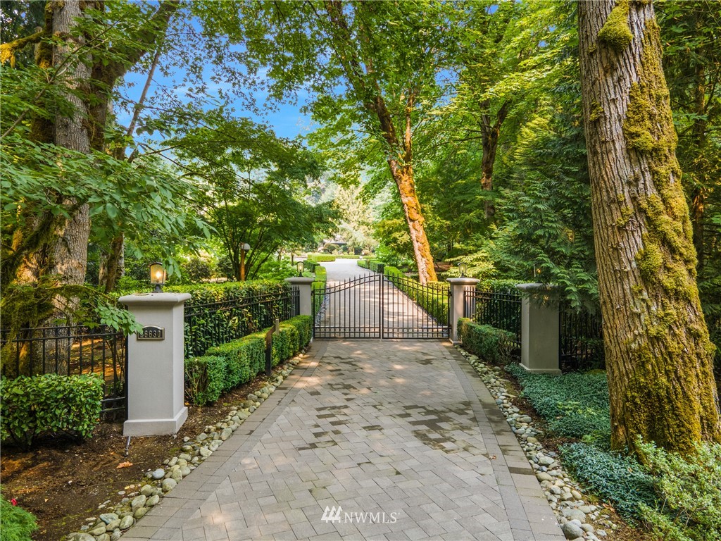 26630 Southeast Issaquah-Fall City Road Issaquah, WA 98029 - Photo 3 of 40 a view of a pathway with a wrought fence