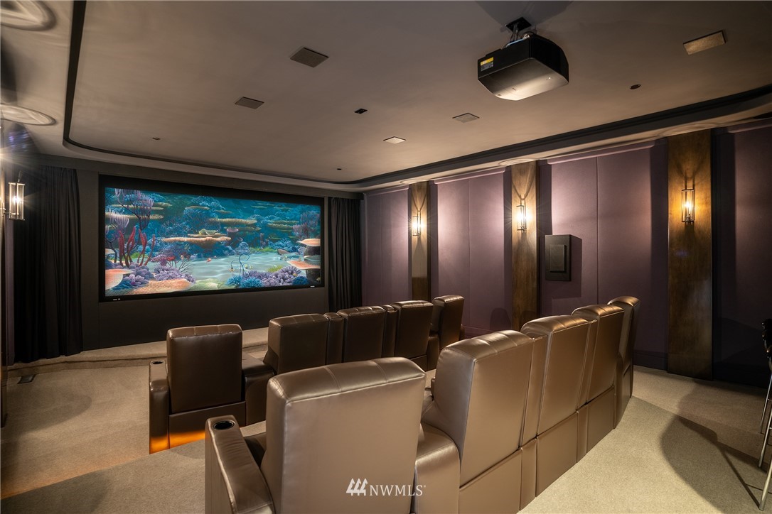 26630 Southeast Issaquah-Fall City Road Issaquah, WA 98029 - Photo 22 of 40 a media room with lots of chairs and a projector screen