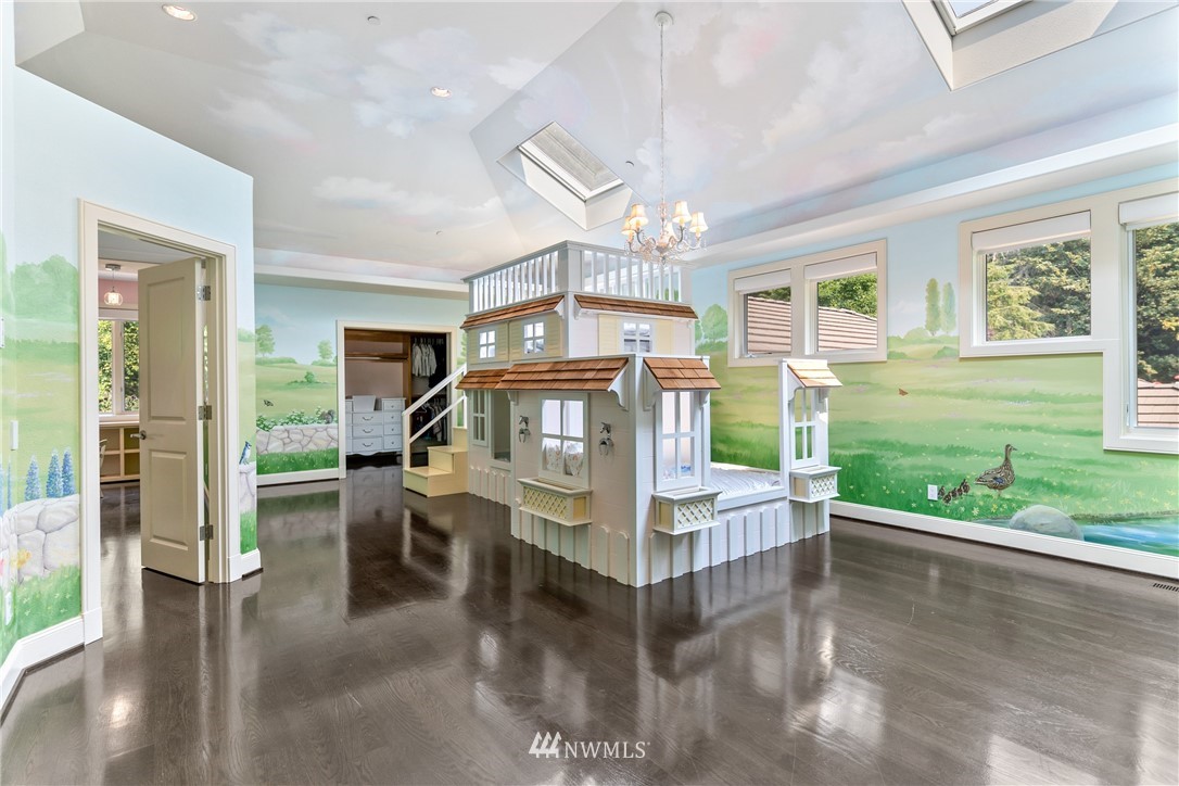 26630 Southeast Issaquah-Fall City Road Issaquah, WA 98029 - Photo 29 of 40 a view of a dining room with furniture a chandelier and wooden floor