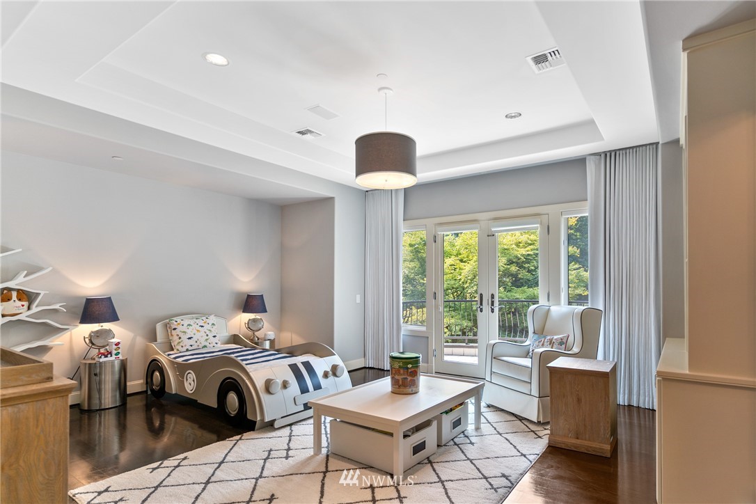 26630 Southeast Issaquah-Fall City Road Issaquah, WA 98029 - Photo 32 of 40 a bedroom with furniture and a large window