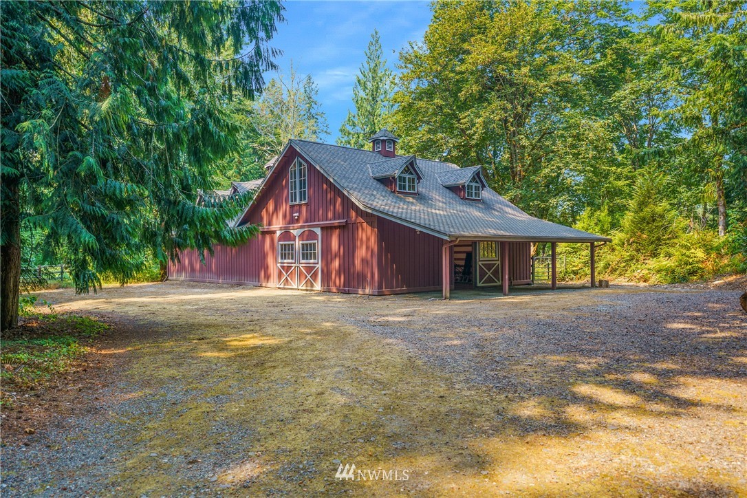 26630 Southeast Issaquah-Fall City Road Issaquah, WA 98029 - Photo 35 of 40 a front view of a house with a garden