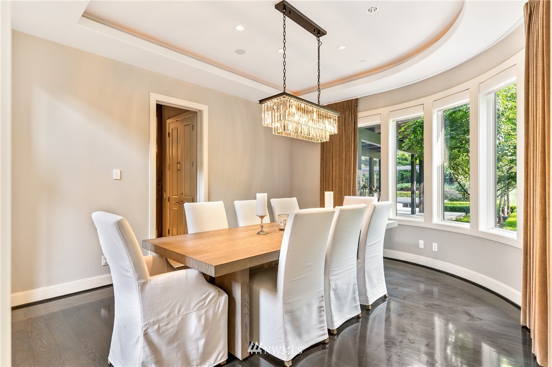 26630 Southeast Issaquah-Fall City Road Issaquah, WA 98029 - Photo 8 of 40 a view of a dining room with furniture wooden floor and chandelier