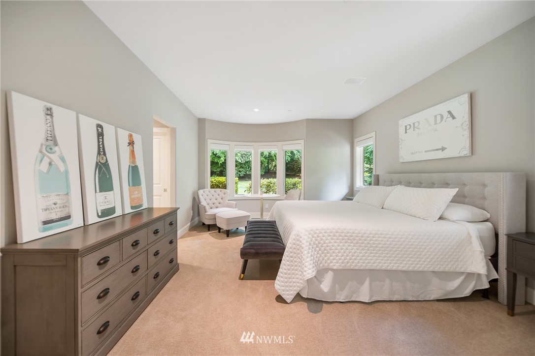 26630 Southeast Issaquah-Fall City Road Issaquah, WA 98029 - Photo 10 of 40 a bedroom with a large bed and a large window