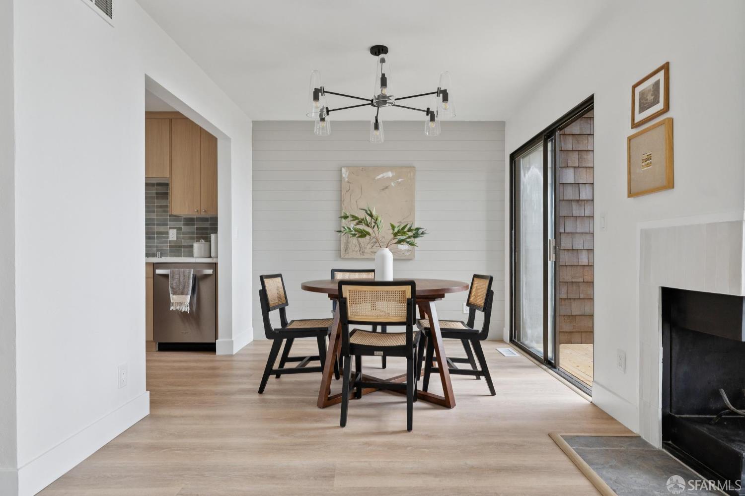 274 Beachview Avenue, Unit 16 Pacifica, CA 94044 - Photo 23 of 81 a dining room with furniture a chandelier and wooden floor