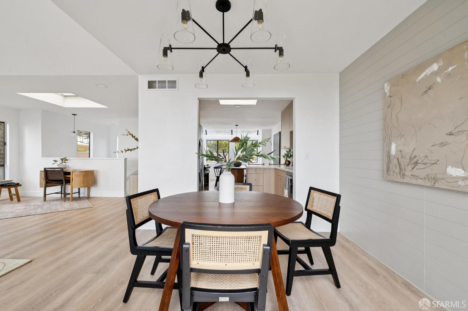 274 Beachview Avenue, Unit 16 Pacifica, CA 94044 - Photo 24 of 81 a view of a dining room with furniture and wooden floor