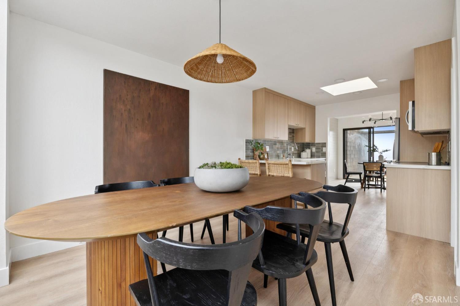 274 Beachview Avenue, Unit 16 Pacifica, CA 94044 - Photo 30 of 81 a view of a dining room with furniture and wooden floor