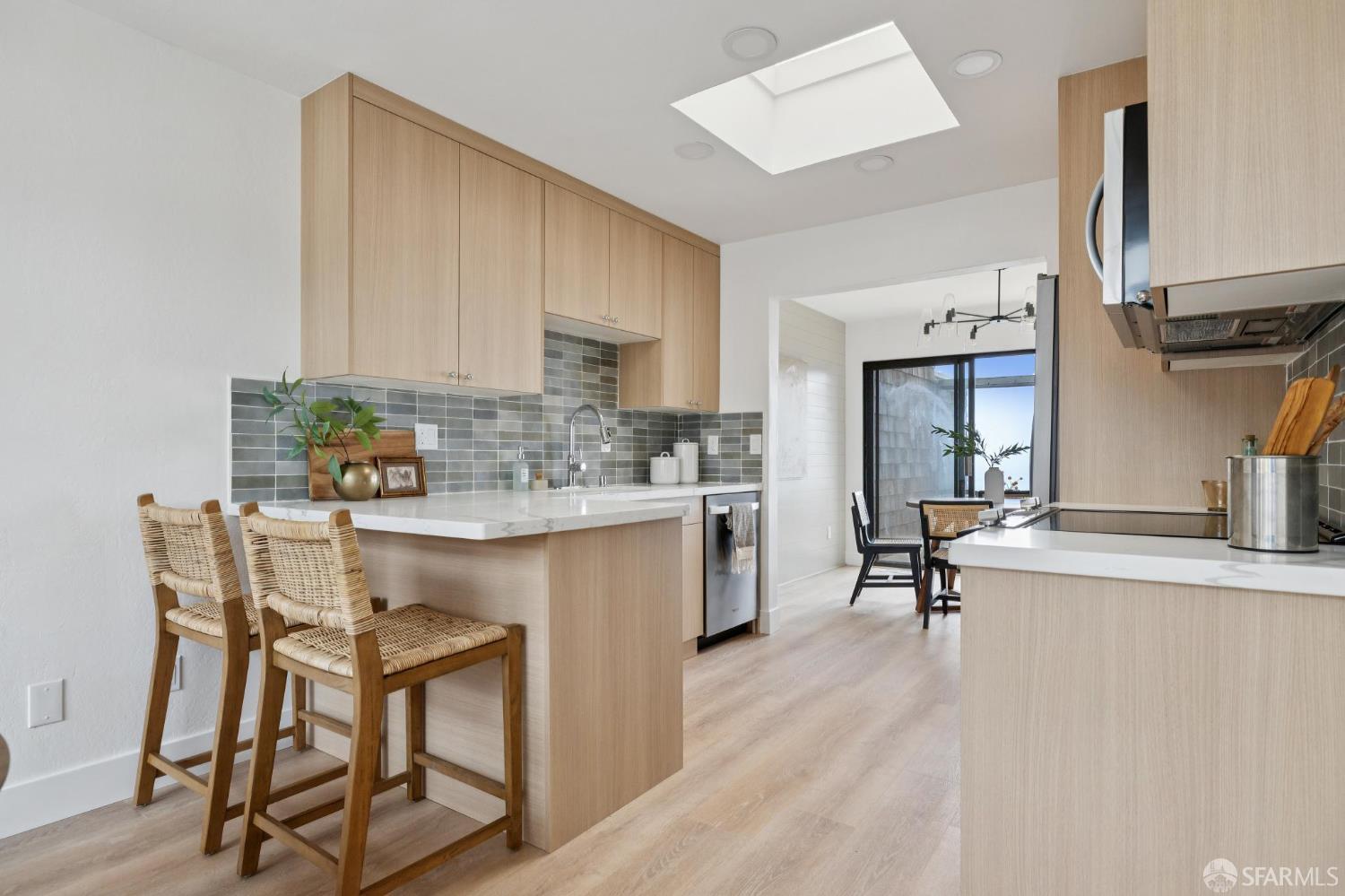 274 Beachview Avenue, Unit 16 Pacifica, CA 94044 - Photo 34 of 81 a kitchen with stainless steel appliances granite countertop a white cabinets and a stove top oven