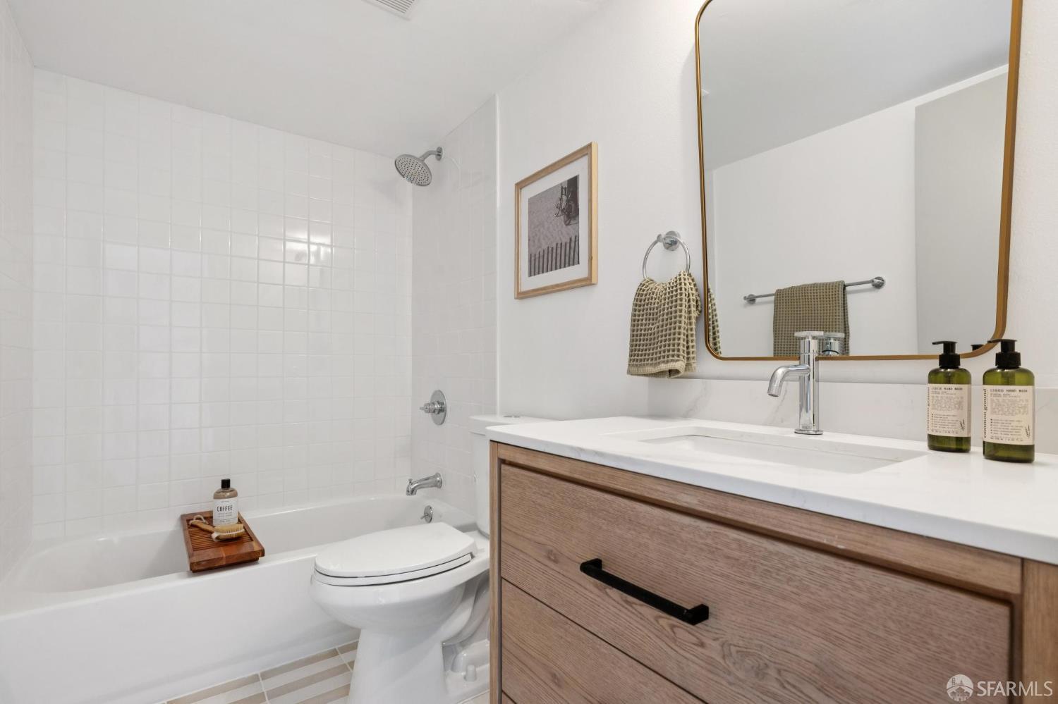 274 Beachview Avenue, Unit 16 Pacifica, CA 94044 - Photo 44 of 81 a bathroom with a sink a toilet and a mirror