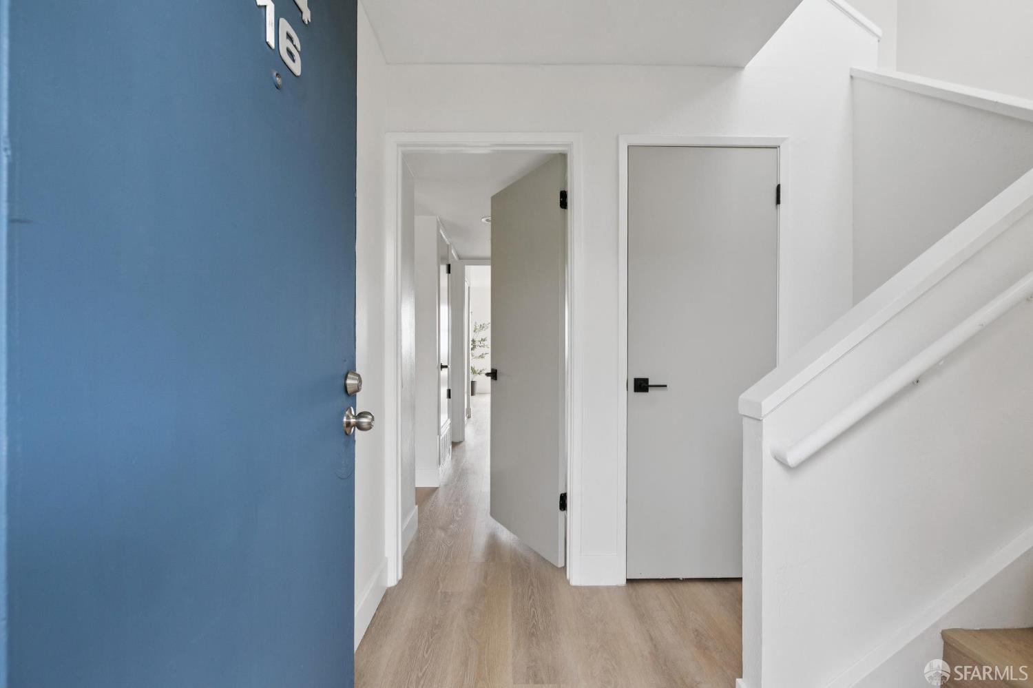 274 Beachview Avenue, Unit 16 Pacifica, CA 94044 - Photo 5 of 81 a view of a hallway with wooden floor and staircase