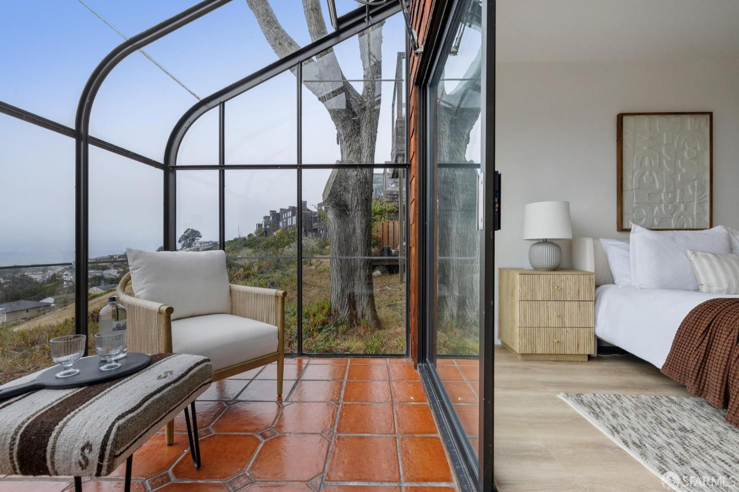 274 Beachview Avenue, Unit 16 Pacifica, CA 94044 - Photo 57 of 81 a bedroom with furniture and a window