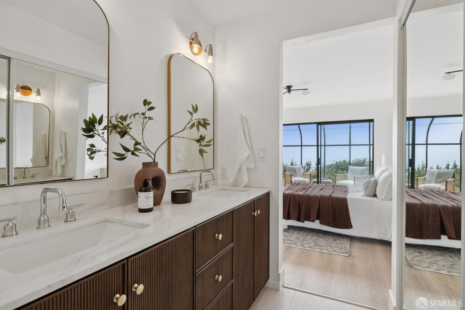 274 Beachview Avenue, Unit 16 Pacifica, CA 94044 - Photo 59 of 81 a en suite bathroom with double vanity and a mirror