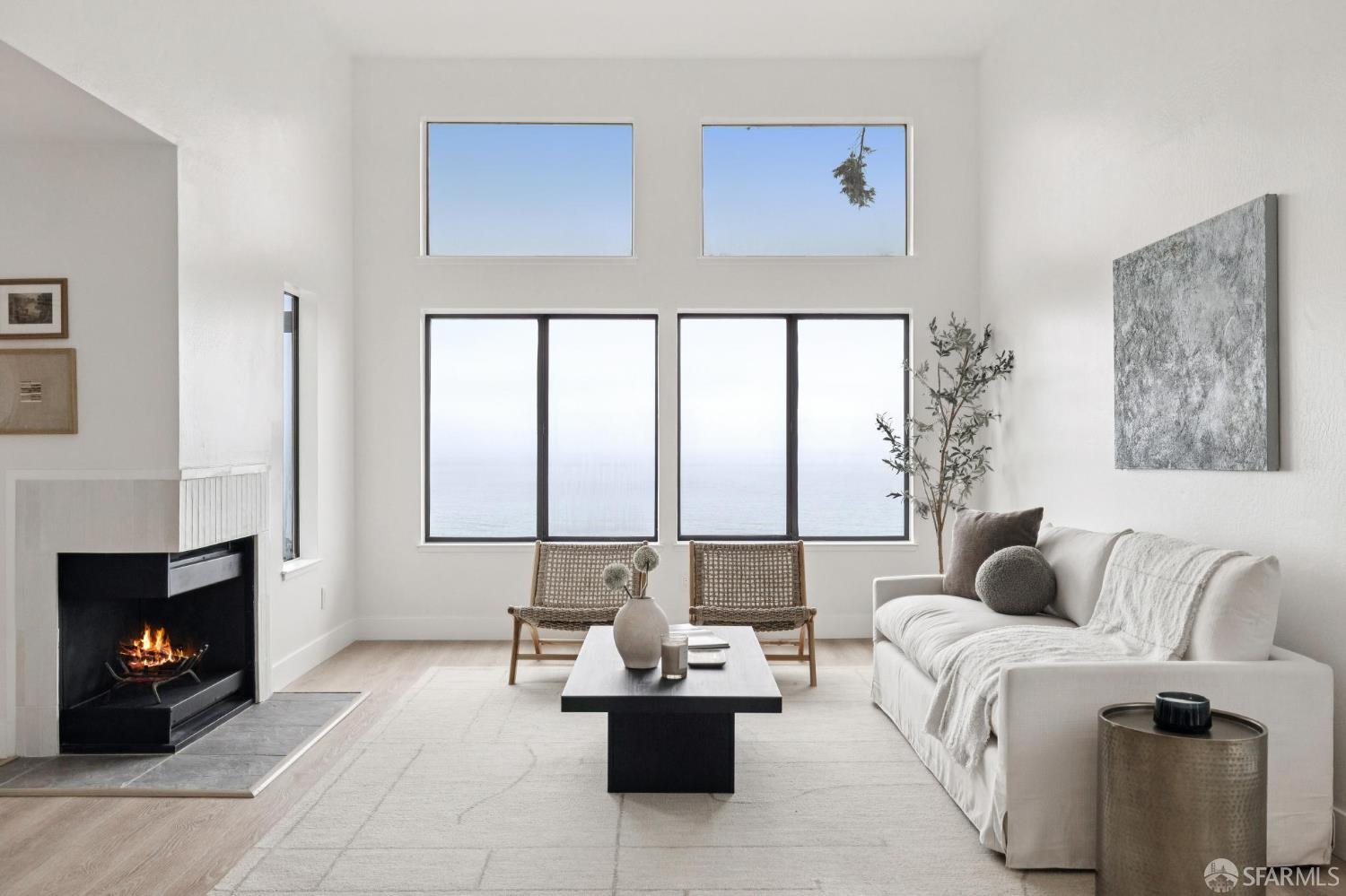 274 Beachview Avenue, Unit 16 Pacifica, CA 94044 - Photo 10 of 81 a living room with furniture and a fireplace