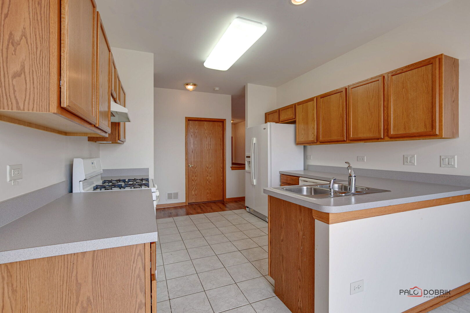 269 Enfield Lane Grayslake, IL 60030 - Photo 11 of 45 a kitchen with stainless steel appliances granite countertop a sink a stove and a refrigerator