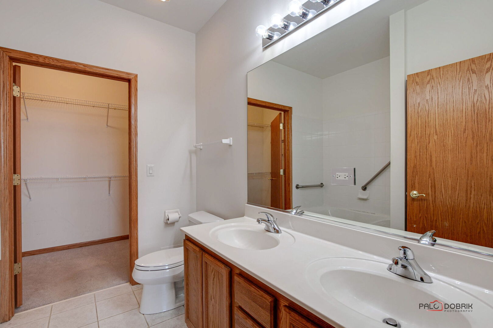 269 Enfield Lane Grayslake, IL 60030 - Photo 17 of 45 a bathroom with a toilet a sink a mirror and shower