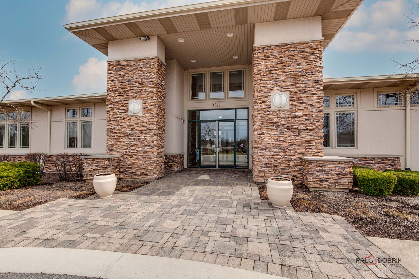 269 Enfield Lane Grayslake, IL 60030 - Photo 32 of 45 a view of a brick house with many windows