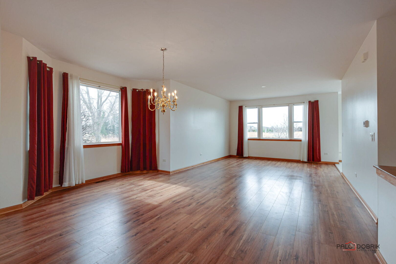 269 Enfield Lane Grayslake, IL 60030 - Photo 4 of 45 an empty room with wooden floor and windows